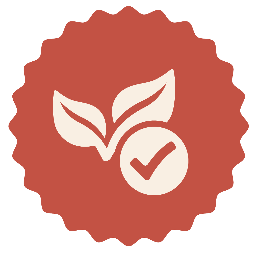graphic of a leaves and checkmark embedded in a scalloped circle.